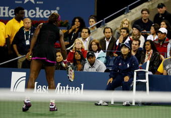 NEW YORK - SEPTEMBER 12:  Serena Williams (L) argues with a line judge during her Women's Singles Semifinal match against Kim Clijsters of Belgium on day thirteen of the 2009 U.S. Open at the USTA Billie Jean King National Tennis Center on September 12, 2009 in the Flushing neighborhood of the Queens borough of New York City.  Clijsters defeated Williams 6-4, 7-5.  (Photo by Julian Finney/Getty Images)