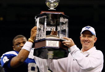 NEW ORLEANS - DECEMBER 20:  Quarterback Dwight Dasher #9 and head coach Rick Stockstill of the Middle Tennessee Blue Raiders celebrate after defeating the Southern Miss Golden Eagles 42-32 during the R+L Carriers New Orleans Bowl at the Louisiana Superdome on December 20, 2009 in New Orleans, Louisiana.  (Photo by Chris Graythen/Getty Images)