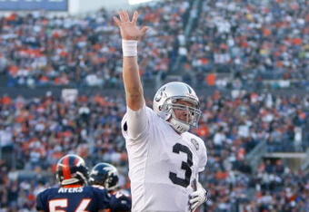 DENVER - DECEMBER 20:  Quarterback Charlie Frye #3 of the Oakland Raiders celebrates after Michael Bush (not pictured) scored a touchdown in the second quarter against the Denver Broncos at Invesco Field at Mile High on December 20, 2009 in Denver, Colorado. The Raiders defeated the Broncos 20-19. (Photo by Jeff Gross/Getty Images)