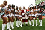 MIAMI - DECEMBER 14:  Cheerleaders pose with Santa Claus as the San Francisco 49ers take on the Miami Dolphins at Dolphin Stadium on December 14, 2008 in Miami, Florida. The Dolphins defeated the 49ers 14-9.  (Photo by Doug Benc/Getty Images)