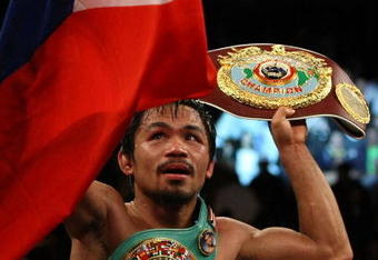 LAS VEGAS - NOVEMBER 14:  Manny Pacquiao celebrates his 12 round TKO victory against Miguel Cotto during their WBO welterweight title fight at the MGM Grand Garden Arena on November 14, 2009 in Las Vegas, Nevada.  (Photo by Al Bello/Getty Images)