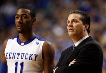 LEXINGTON, KY - DECEMBER 21:  John Calipari the Head Coach of the Kentucky Wildcats and John Wall #11 are pictured during the 88-44 victory over the Drexel Dragons at Rupp Arena on December 21, 2009 in Lexington, Kentucky. The victory was the 2,000th in the history of Kentucky basketball.  (Photo by Andy Lyons/Getty Images)