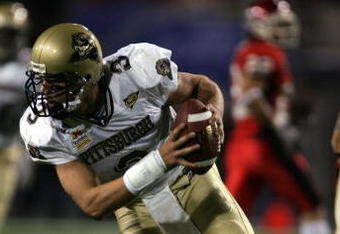 TEMPE, AZ - JANUARY 1:  Quarterback Tyler Plako runs with the ball against Pittsburgh in the Tostito's Fiesta Bowl at the Sun Devil Stadium on January 1, 2005 in Tempe, Arizona.  Utah won the game with the score of 35-7.  (Photo by Harry How/Getty Images).