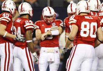 ARLINGTON, TX - DECEMBER 5: Quarterback Zac Lee of the Nebraska Cornhuskers huddles with his team during the first quarter of the game against the Texas Longhorns at Cowboys Stadium on December 5, 2009 in Arlington, Texas. (Photo by Ronald Martinez/Getty Images)