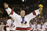 SALT LAKE CITY - FEBRUARY 24:  Goaltender Martin Brodeur #30 of Canada smiles as he skates with his gold medal around his neck after the game against the USA in the men's ice hockey gold medal game at the 2002 Salt Lake City Winter Olympic Games on February 24, 2002 at the E Center in Salt Lake City, Utah.  Canada defeated the USA 5-2.  (Photo by Brian Bahr/Getty Images)