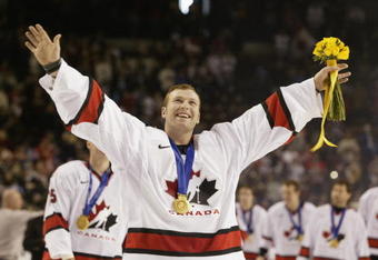 SALT LAKE CITY - FEBRUARY 24:  Goaltender Martin Brodeur #30 of Canada smiles as he skates with his gold medal around his neck after the game against the USA in the men's ice hockey gold medal game at the 2002 Salt Lake City Winter Olympic Games on February 24, 2002 at the E Center in Salt Lake City, Utah.  Canada defeated the USA 5-2.  (Photo by Brian Bahr/Getty Images)