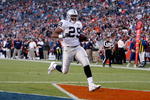 DENVER - DECEMBER 20:  Michael Bush #29 of the Oakland Raiders carries the ball into the endzone for a touchdown against the Denver Broncos at Invesco Field at Mile High on December 20, 2009 in Denver, Colorado.  (Photo by Jeff Gross/Getty Images)