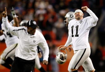 DENVER - DECEMBER 20:  Sebastian Janikowski (R) #11 of the Oakland Raiders celebrates a victory over the Denver Broncos at Invesco Field at Mile High on December 20, 2009 in Denver, Colorado. The Raiders defeated the Broncos 20-19.  (Photo by Jeff Gross/Getty Images)