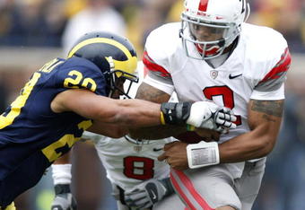 ANN ARBOR, MI - NOVEMBER 21:  Terrelle Pryor #2 of the Ohio State Buckeyes tries to get around Troy Woolfolk #29 of the Michigan Wolverines on November 21, 2009 at Michigan Stadium in Ann Arbor, Michigan.  (Photo by Gregory Shamus/Getty Images)