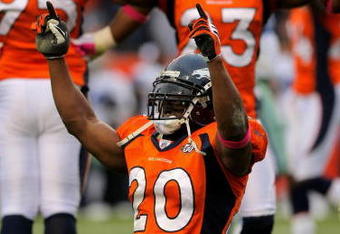 DENVER - OCTOBER 04:  Brian Dawkins #20 and Renaldo Hill #23 of the Denver Broncos celebrate after the Dallas Cowboys on fourth down with :01 second remaining in the game during NFL action at Invesco Field at Mile High on October 4, 2009 in Denver, Colorado. The Broncos defeated the Cowboys 17-10.  (Photo by Doug Pensinger/Getty Images)