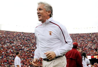 LOS ANGELES, CA - DECEMBER 05:  Coach Pete Carroll of the USC Trojans leads his team to the field prior to the start of the NCAA college football game against Arizona Wildcats at the Los Angeles Coliseum on December 5, 2009 in Los Angeles, California.  (Photo by Kevork Djansezian/Getty Images)