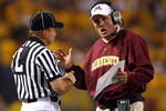 MINNEAPOLIS - SEPTEMBER 13:  Minnesota Golden Gophers' head coach Tim Brewster talks with an official during the game against the Montana State Bobcats at the Metrodome on September 13, 2008 in Minneapolis, Minnesota. Minnesota defeated Montana State 35-23.  (Photo by Jeff Gross/Getty Images)