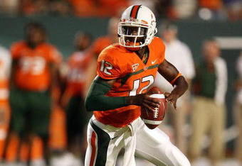 MIAMI GARDENS, FL - SEPTEMBER 17:  Quarterback Jacory Harris #12 of the Miami Hurricanes scrambles against the Georgia Tech Yellow Jackets at Land Shark Stadium on September 17, 2009 in Miami Gardens, Florida. Miami defeated Georgia Tech 33-17.  (Photo by Doug Benc/Getty Images)