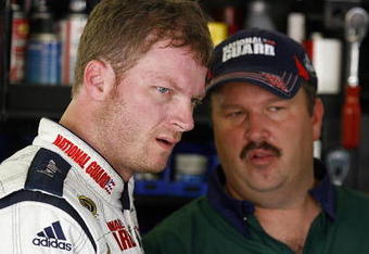 KANSAS CITY, KS - SEPTEMBER 26:  Dale Earnhardt Jr. (L), driver of the #88 AMP Energy/National Guard Chevrolet, speaks with crew chief Tony Eury Jr. (R), during practice for the NASCAR Sprint Cup Series Camping World RV 400 at Kansas Speedway on September 26, 2008 in Kansas City, Kansas.  (Photo by Jason Smith/Getty Images for NASCAR)