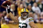 MINNEAPOLIS - OCTOBER 05:  Linebacker Clay Matthews #52 of the Green Bay Packers celebrates after running back an interception for a touchdown during the game against  the Minnesota Vikings on October 5, 2009 at Hubert H. Humphrey Metrodome in Minneapolis, Minnesota.  (Photo by Jamie Squire/Getty Images)