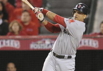 ANAHEIM, CA - OCTOBER 09:  Victor Martinez #41 of the Boston Red Sox hits a single to score Jacoby Ellsbury #46 in the fourth inning of Game Two of the ALDS against the Los Angeles Angels of Anaheim during the 2009 MLB Playoffs at Angel Stadium on October 9, 2009 in Anaheim, California.  (Photo by Lisa Blumenfeld/Getty Images)