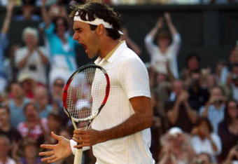 WIMBLEDON, ENGLAND - JULY 05:  Roger Federer of Switzerland celebrates victory during the men's singles final match against Andy Roddick of USA on Day Thirteen of the Wimbledon Lawn Tennis Championships at the All England Lawn Tennis and Croquet Club on July 5, 2009 in London, England. Federer won 5-7, 7-6, 7-6, 3-6, 16-14.  (Photo by Clive Brunskill/Getty Images)