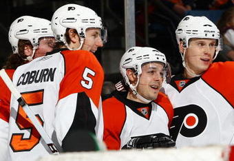 UNIONDALE, NY - DECEMBER 27: Danny Briere #48 (3rd L) of the Philadelphia Flyers is congratulated by team amtes after scoring a goal against the New York Islanders on December 27, 2009 at the Nassau Coliseum in Uniondale, New York.  (Photo by Chris McGrath/Getty Images)