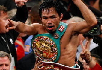 LAS VEGAS - NOVEMBER 14:  Manny Pacquiao celebrates his 12 round TKO victory against Miguel Cotto during their WBO welterweight title fight at the MGM Grand Garden Arena on November 14, 2009 in Las Vegas, Nevada.  (Photo by Ethan Miller/Getty Images)