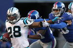 EAST RUTHERFORD, NJ - DECEMBER 27:  Jonathan Stewart #28 of the Carolina Panthers rushes against the New York Giants at Giants Stadium on December 27, 2009 in East Rutherford, New Jersey.  (Photo by Nick Laham/Getty Images)