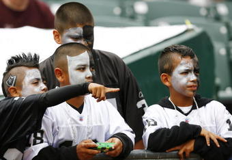 OAKLAND, CA - SEPTEMBER 23:  Oakland Raiders fans watch the players during the pregame period of the Raiders 26-24 win over the Cleveland Browns at McAfee Coliseum on September 23, 2007 in Oakland, California.  (Photo by Kevin Terrell/Getty Images)