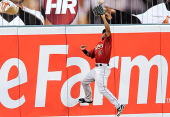 BALTIMORE - JUNE 18:  Michael Bourn #14 of the Houston Astros makes a leaping catch against the Baltimore Orioles at Camden Yards June 18, 2008 in Baltimore, Maryland.  (Photo by Greg Fiume/Getty Images)
