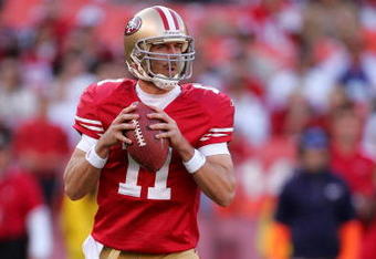 SAN FRANCISCO - NOVEMBER 29:  Alex Smith #11 of the San Francisco 49ers drops back to pass during their game against the Jacksonville Jaguars at Candlestick Park on November 29, 2009 in San Francisco, California.  (Photo by Ezra Shaw/Getty Images)