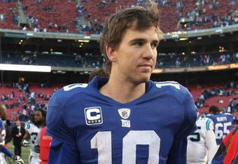 EAST RUTHERFORD, NJ - DECEMBER 27:  Eli Manning #10 of the New York Giants walks from the field after losing to the Carolina Panthers at Giants Stadium on December 27, 2009 in East Rutherford, New Jersey.  (Photo by Nick Laham/Getty Images)