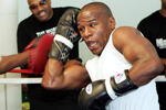 LAS VEGAS - MAY 01:  Boxer Floyd Mayweather Jr. works out as his manager Leonard Ellerbe looks on at the Mayweather Boxing Club May 1, 2007 in Las Vegas, Nevada. Mayweather will fight Oscar De La Hoya for the WBC super welterweight championship at the MGM Grand on May 5, 2007.  (Photo by Ethan Miller/Getty Images)