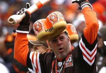 CLEVELAND - DECEMBER 27:  A Cleveland Browns fan cheers against the Oakland Raiders at Cleveland Browns Stadium on December 27, 2009 in Cleveland, Ohio.  (Photo by Matt Sullivan/Getty Images)