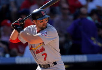 DENVER - SEPTEMBER 27:  Mark DeRosa #7 of the St. Louis Cardinals takes an at bat against the Colorado Rockies at Coors Field on September 27, 2009 in Denver, Colorado. The Rockies defeated the Cardinals 4-3.  (Photo by Doug Pensinger/Getty Images)