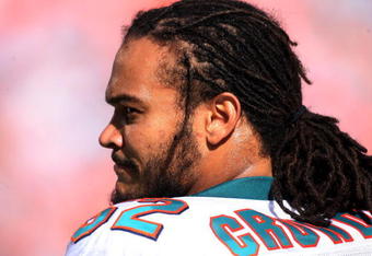 MIAMI - OCTOBER 04:  Linebacker Channing Crowder #52  of the Miami Dolphins looks on against the Buffalo Bills at Land Shark Stadium on October 4, 2009 in Miami, Florida. Miami defeated Buffalo 31-30.  (Photo by Marc Serota/Getty Images)