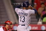 ANAHEIM, CA - AUGUST 11:  Carl Crawford #13 of the Tampa Bay Rays bats against the Los Angeles Angels of Anaheimon August 11, 2009 at Angel Stadium in Anaheim, California.  (Photo by Stephen Dunn/Getty Images)
