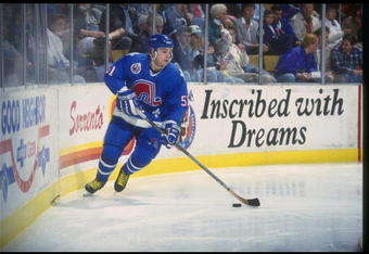 25 Nov 1992:  Rightwinger Andrei Kovalenko of the Quebec Nordiques moves the puck during a game against the Buffalo Sabres at Memorial Auditorium in Buffalo, New York. Mandatory Credit: Rick Stewart  /Allsport