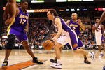 PHOENIX - DECEMBER 28:  Steve Nash #13 of the Phoenix Suns drives the ball past  Derek Fisher #2 of the Los Angeles Lakers during the NBA game at US Airways Center on December 28, 2009 in Phoenix, Arizona.  The Suns defeated the Lakers 118-103. NOTE TO USER: User expressly acknowledges and agrees that, by downloading and or using this photograph, User is consenting to the terms and conditions of the Getty Images License Agreement.  (Photo by Christian Petersen/Getty Images)