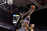 LEXINGTON, KY - DECEMBER 23:  DeMarcus Cousins #15 of the Kentucky Wildcats and T.J.Robinson #15 of the Long Beach State 49ers reach for a rebound during the game at Rupp Arena on December 23, 2009 in Lexington, Kentucky.  (Photo by Andy Lyons/Getty Images)