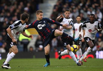LONDON, ENGLAND - NOVEMBER 28:  Ivan Klasnic (2nd L) of Bolton contests with Aaron Hughes (L), Chris Baird (2nd R) and John Paintsil (R) of Fulham during the Barclays Premier League match between Fulham and Bolton Wanderers at Craven Cottage on November 28, 2009 in London, England.  (Photo by Hamish Blair/Getty Images)