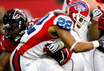 ATLANTA - DECEMBER 27:  Chauncey Davis #92 of the Atlanta Falcons tackles Fred Jackson #22 of the Buffalo Bills at Georgia Dome on December 27, 2009 in Atlanta, Georgia.  (Photo by Kevin C. Cox/Getty Images)