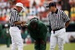 MIAMI - OCTOBER 04:  Head coach Randy Shannon of the Miami Hurricanes reacts after hearing an explanation of a call from referee Jack Childress, L, and field judge Mike Cullin while taking on the Florida State Seminoles at Dolphin Stadium on October 4, 2008 in Miami, Florida.  (Photo by Doug Benc/Getty Images)