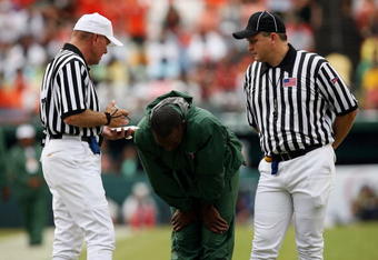 MIAMI - OCTOBER 04:  Head coach Randy Shannon of the Miami Hurricanes reacts after hearing an explanation of a call from referee Jack Childress, L, and field judge Mike Cullin while taking on the Florida State Seminoles at Dolphin Stadium on October 4, 2008 in Miami, Florida.  (Photo by Doug Benc/Getty Images)