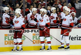 WASHINGTON - DECEMBER 28:  Eric Staal #12 of the Carolina Hurricanes celebrates with teammates after scoring in the first period against the  Washington Capitals at the Verizon Center on December 28, 2009 in Washington, DC.  (Photo by Greg Fiume/Getty Images)