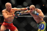 LAS VEGAS - JULY 11:  (L-R) Georges St. Pierre battles Thiago Alves during their welterweight title bout during UFC 100 on July 11, 2009 in Las Vegas, Nevada.  (Photo by Jon Kopaloff/Getty Images)