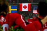 TURIN, ITALY - FEBRUARY 20:  Members of team Canada listen to the Canadian national anthem after defeating Sweden 4-1 to win the gold medal in the final of the women's ice hockey during Day 10 of the Turin 2006 Winter Olympic Games on February 20, 2006 at the Palasport Olimpico in Turin, Italy.  (Photo by Brian Bahr/Getty Images)