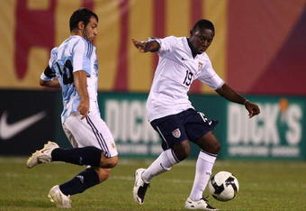 EAST RUTHERFORD, NJ - JUNE 08:  Freddy Adu #19  of the United States of America drives the ball past Javier Mascherano #14  of Argentina during their match at Giants Stadium on June 8, 2008 in East Rutherford, New Jersey.  (Photo by Al Bello/Getty Images)