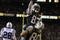 EAST RUTHERFORD, NJ - JANUARY 4:  Santana Moss #83 of the New York Jets is lifted in celebration by teammate Wayne Chrebet #80 after Moss scored a touchdown against the Indianapolis Colts during the AFC wildcard game at Giants Stadium on January 4, 2003 in East Rutherford, New Jersey.  The Jets won 41-0.  (Photo by Al Bello/Getty Images)