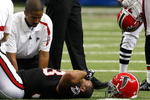 ATLANTA - NOVEMBER 29:  Michael Turner #33 of the Atlanta Falcons lay on the field after being injured against the Tampa Bay Buccaneers at Georgia Dome on November 29, 2009 in Atlanta, Georgia.  (Photo by Kevin C. Cox/Getty Images)