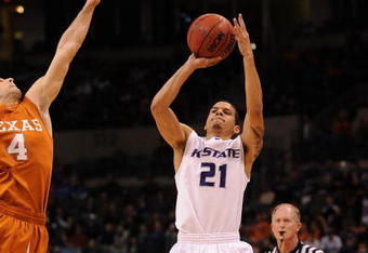 OKLAHOMA CITY - MARCH 12:  Guard Denis Clemente #21 of the Kansas State Wildcats takes a shot against Dogus Balbay #4 of the Texas Longhorns during the Phillips 66 Big 12 Men's Basketball Championship Quarterfinals at the Ford Center March 12, 2009 in Oklahoma City, Oklahoma.  (Photo by Ronald Martinez/Getty Images)