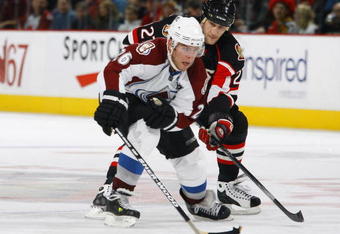 OTTAWA, ON - DECEMBER 30:  Paul Stastny #26 of the Colorado Avalanche carries the puck up ice while being chased by Alex Kovalev #27 of the Ottawa Senators in a game at Scotiabank Place on December 30, 2009 in Ottawa, Canada.  (Photo by Phillip MacCallum/Getty Images)