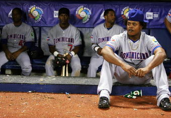 SAN JUAN, PUERTO RICO - MARCH 10:  Edinson Volquez #36 (R), Damaso Marte #43, Jose Reyes #7 and Robinson Cano #24 (2R) of the Dominican Republic react after losing 3-2 against the Netherlands during the 2009 World Baseball Classic Pool D match at Hiram Bithorn Stadium March 10, 2009 in San Juan, Puerto Rico.  (Photo by Al Bello/Getty Images)