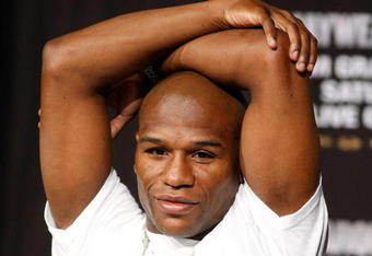 LAS VEGAS - SEPTEMBER 16:  Boxer Floyd Mayweather Jr. stretches during the final news conference for his bout against Juan Manuel Marquez at the MGM Grand Hotel/Casino September 16, 2009 in Las Vegas, Nevada. The two will fight at the MGM Grand Garden Arena on September 19 in Las Vegas.  (Photo by Ethan Miller/Getty Images)